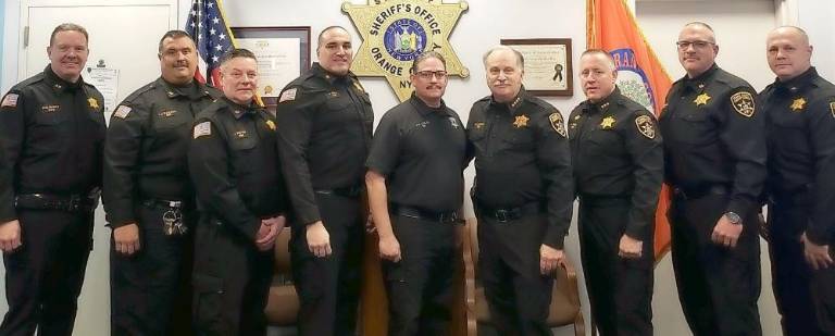 From left: Chief Dennis Barry, Captain Larry Catletti, Captain Jimmy Potter, Colonel Tony Mele, Officer David Colon, Sheriff Carl DuBois, Assistant Undersheriff Tony Weed, Captain Vinny Dichiaro, Captain Paul Arteta
