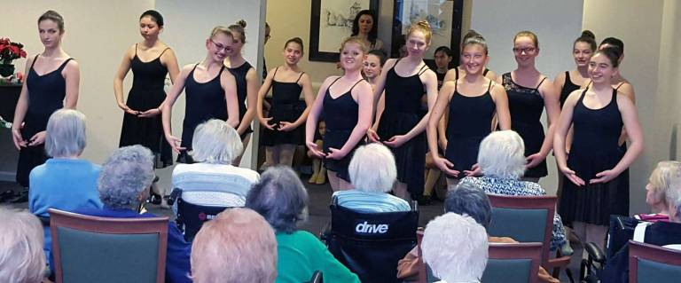 Girls representing all company levels perform &quot;Waltz of the Flowers&quot; from The Nutcracker to residents.
