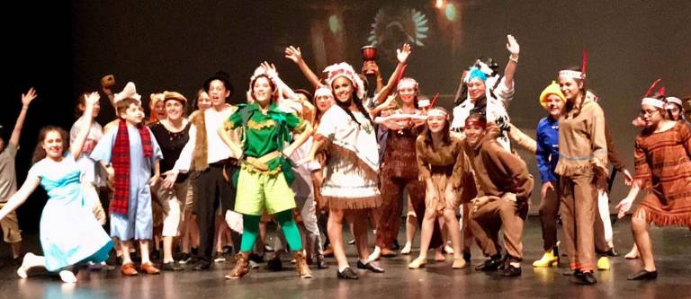 Photo by Jake Gardner Peter Pan (Anya Quinn) and members of the cast strike a pose during a recent dress rehearsal for Souza&#x2019;s Peter Pan, opening this weekend.