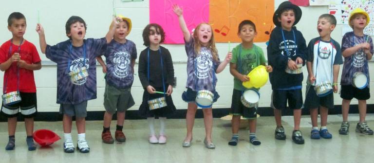 Campers in the &igrave;Davening Drums&icirc; bunk drum as they record their song for the Music Mitzvah Video.