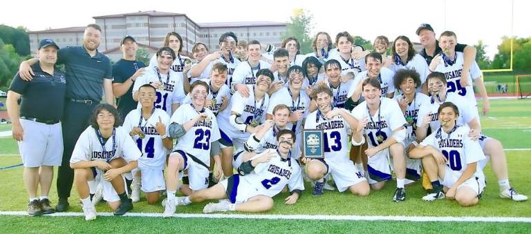 The Section 9 Champion Crusaders celebrate their victory over Kingston. Photos by William Dimmit.