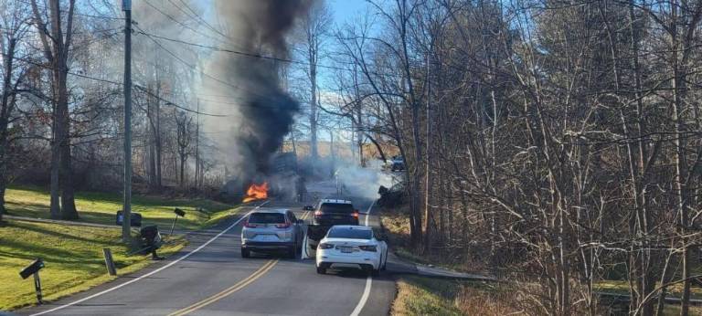 Dump truck ignites after crash with SUV