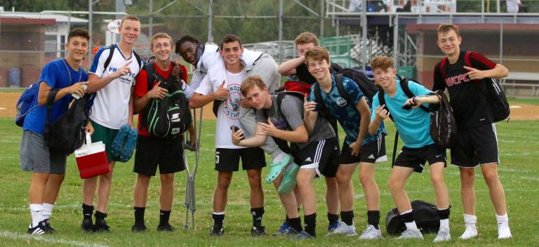 The season goes on: Some of the Crusaders head to practice on Thursday, carrying an injured teammate. Even with the injury list growing, the team displays the will to fight on.