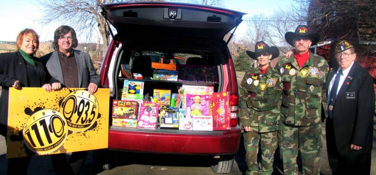 On Monday, Dec. 15, WTBQ owner Frank Truitt, Station Manager Taylor Sterling and Frank þÄúUncle BuckþÄù Pileggi, co-host of the Thursday þÄúFrank Truitt Morning Show,þÄù presented a carload of toys to Pete and Laura Rollins, co-founders of Goshen Chapter 212, Disabled American Veterans. From left, WTBQ Station Manager Taylor Sterling, owner Frank Truitt, Laura and Pete Rollins and Frank þÄúUncle BuckþÄù Pileggi.