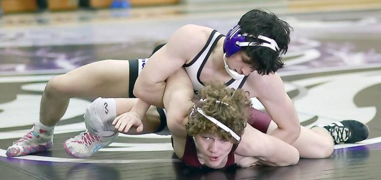 Michael Rosenblum, wrestling at 145 lbs., turns his opponent before pining him at 2:10 of his match.