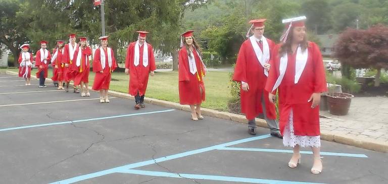 Class of 2020 George F. Baker High School graduates marching to “Pomp and Circumstance.”