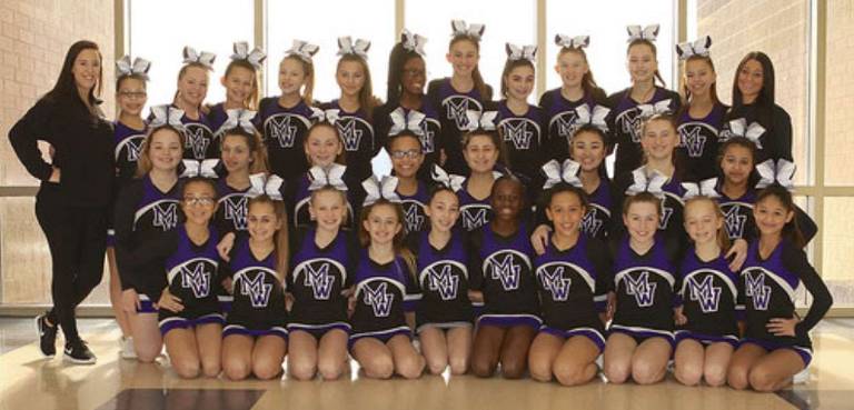 The Monroe-Woodbury Modified Cheerleading team.