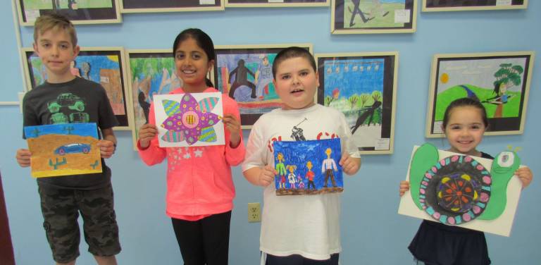 Fourth-grader Dominik Cichon, left, fifth-grader Alana Gorukanti, third-grader Dominick Chillino, and kindergartener Marella Nissirios.
