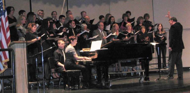 Provided photo The Monroe-Woodbury Faculty and Friends Chorale performs at a previous Faculty Concert, conducted by Dr. David Crone and accompanied by District Music Coordinator Nicole Regan.
