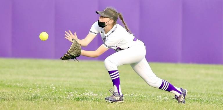 Centerfielder Danielle Ryan makes a diving catch of a Wildcat line drive.