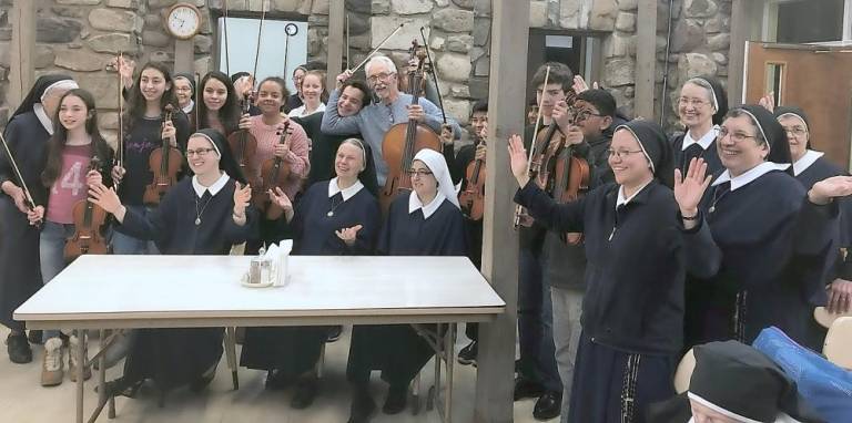 Marycrest Sisters with Allegro members having a little fun after the concert on Dec. 12.