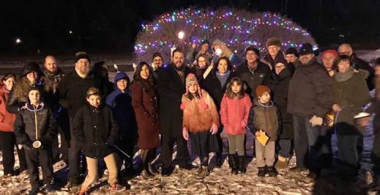 Photo courtesy of Dr. Seth Pulver Community members brave the cold to attend a public menorah lighting ceremony in Tuxedo.
