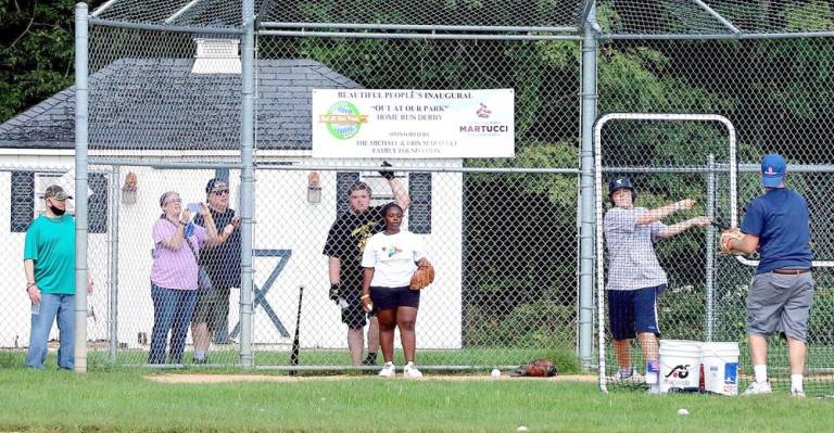 Adults and older athletes were swinging for the fences while younger competitors had modified home run targets. Photo by Roger Gavan.