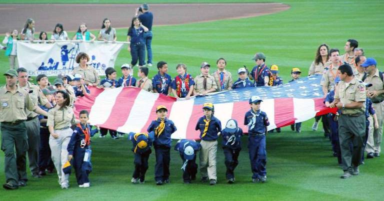 Entering the stadium&iacute;s field are Cub Scout Pack 340, Boy Scout Troop 340 and other scouts from the tri-state area.