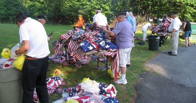By Roger Gavan Perhaps due to the installation of a convenient used flag disposal box and a favorable public response, there was a much larger number of flags to be destroyed than usual.