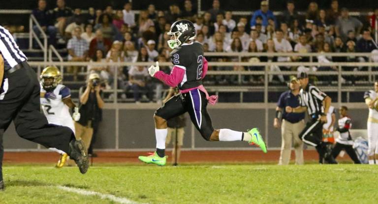 Crusader Kenny Hernandez (#2) scores on a 52-yard touchdown pass in the first quarter.