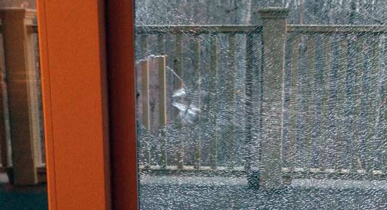 A close- up of the damage done by the bullet at Patricia Tripken's home.