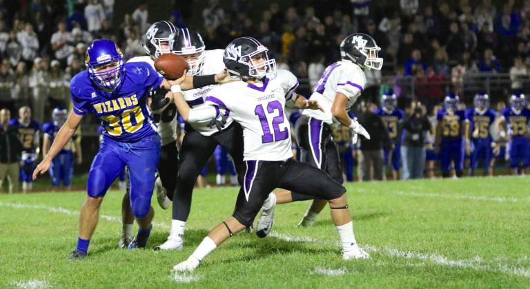 Steven Campione (#12) threw for two touchdowns and ran for two more.