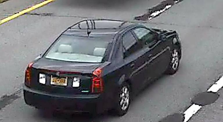 State Police say driver of this black Cadillac has been known to pass the counterfeit bills in the Village of Florida in Orange County.