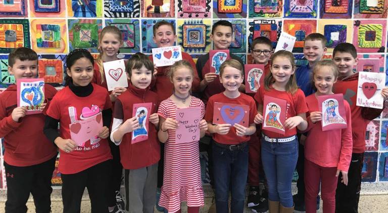 Photo provided by Carole Spendley Some members of the Pine Tree Patriot Club display homemade Valentine greetings that are on their way to troops serving overseas and to local veterans.