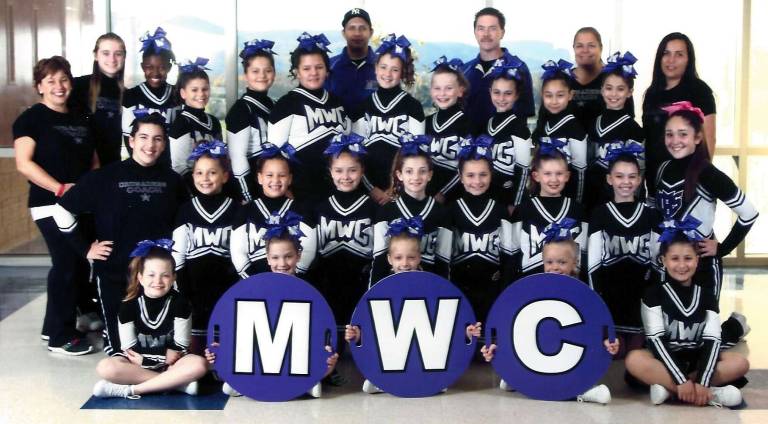 The Junior Pee Wees, in the back row from the left: Coach Robin Wolfenhaut, Trainer Katelyn McCarthy, Kelli Gatling, Gina Pirraglia, Veronica Woodley, Anastasia Nelson, Coach Louie Melendez, Olivianna Eiler, Caroline Kivlehan, Coach Mark Chapman, Haiely Genzale, Brittany Castellanos, Coach Joan Eiler, Hailey Proscia and Coach Lina Nelson. Middle row: Trainer Mary Ann Nelson, Julianne Wolfenhaut, Jaelyn Melendez, Madison Kreischer, Alyssa Caruso, Danielle Kelleher, Hailey Chapman, Makayla Donnelly and Trainer Sophia Quintana. First row: Jordyn Casserly, Alexis Newcomb, Brittany Francella, Carley Mackenzie and Phoebe Miale.