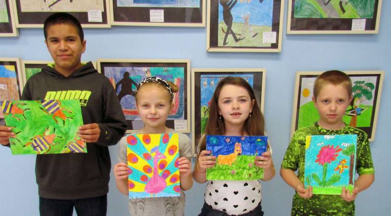 Sixth-grader Marvin Chavez Granillo, left, fifth-grader Anastasia Vishnevskaya, first-grader Kayla Jones-Grade and fourth-grader Kevin Mints.