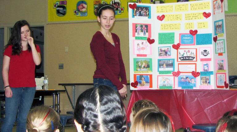 Poster board presentations on proper heart health were part of Troop 502&#xed;s &#xec;Healthy Heart&#xee; Silver Award project.