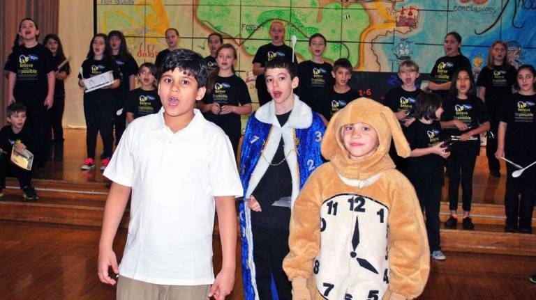 Justin Polanco as Milo, Paul Bochterle as the &quot;Mathemagician&quot; and Christopher Pezzella as &quot;Tock&quot; sing with cast members during rehearsals.