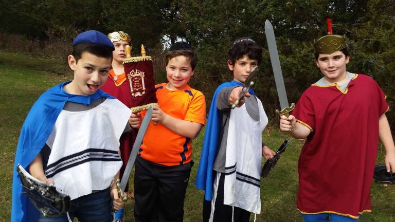 Chabad Hebrew School students re-enact the story of Hanukkah for a special video. Pictured, from left, Ryan Leeds of Monroe, Ben Stock and Max Hershkowitz of Highland Mills, Adi Wolff of Monroe and Zachary Freedman of Warwick.