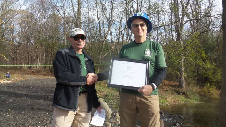 David Booth presented Robert Fuller with the Presidential Volunteer Service Lifetime Achievement Award (Photo by Frances Ruth Harris)