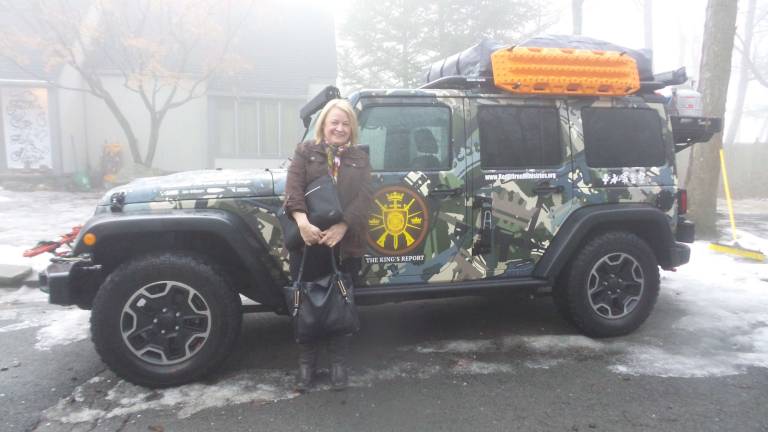 Sean Moon&#x2019;s jeep designed and gifted to him by Kahr Arms. Sean Moon&#x2019;s secretary, Lordes Swars, stands in front of the jeep. (Photo by Frances Ruth Harris)