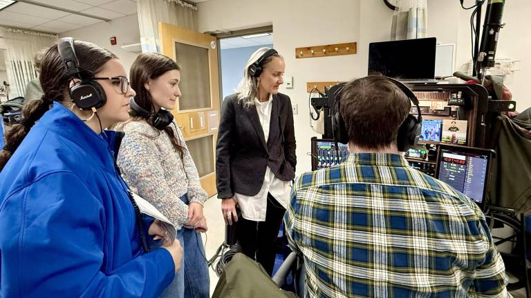 Mount Saint Mary College students and Digital Media Production instructor Merle Becker help at a taping of the Netflix show “Four Seasons” in the school’s Nursing Department.