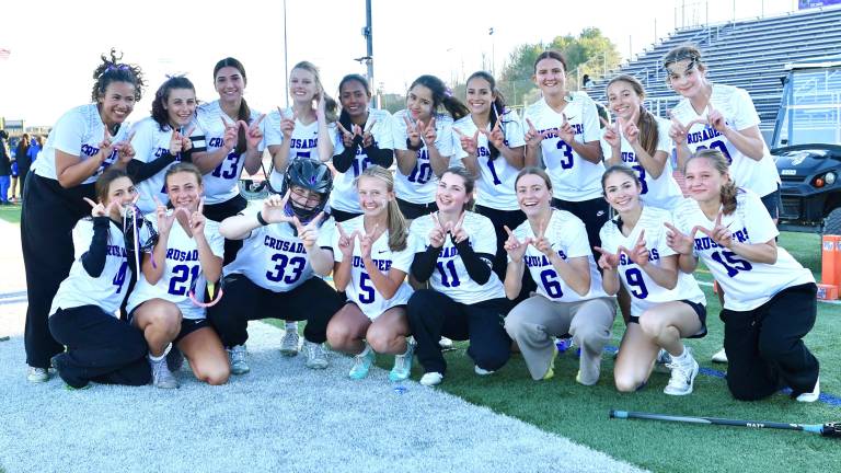 Crusaders celebrate their victory over the Middies.