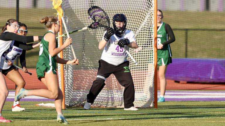 Monroe-Woodbury goalie Lilly Crowley (#45) had a strong game in goal for the Crusaders in their 13-7 season-opening victory March 25 at home in Central Valley against Cornwall. Photos by William Dimmit.