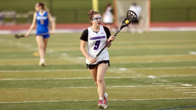 Joslyn Stone brings the ball up field on the attack.