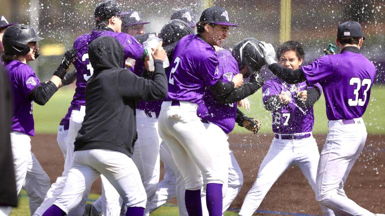 The Crusaders baseball team celebrates their season-opening win over Beacon.