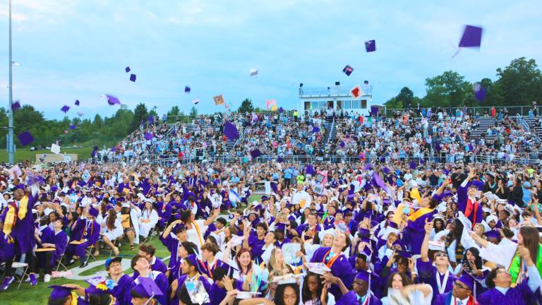 The Class of 2026 throws their hats in the air as the graduation comes to an end.