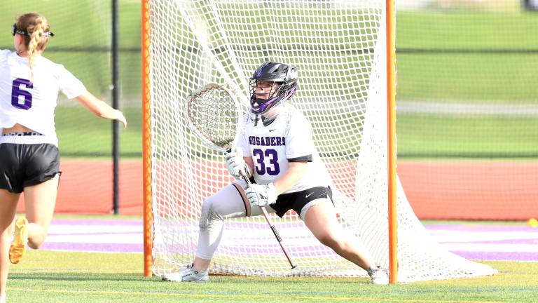 #33, Crusader Goalie Lilly Crowley kept the team in the game with several key saves.