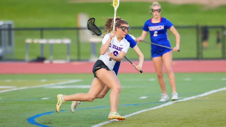 Kyra Gilligan races past a defender on her way to score her 200th goal.