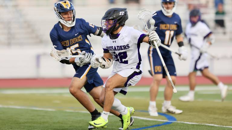 Anthony Severo #22, works past a Bushmen defender.