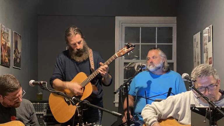 The event featured music by Fire &amp; Gasoline, a local two-piece band that shared the porch with friends.