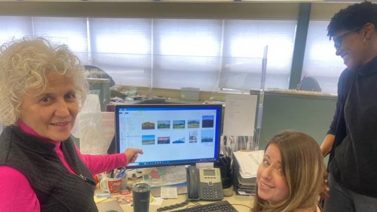 Contest judges choosing their picks. Left to right: Jeanne Straus, Publisher of Straus News; Christina Scotti, Director of Design; Felicia Hodges, Managing Editor of <i>The Warwick Advertiser</i>.)