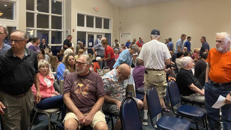 Crowd gathers at Monroe Town Hall for a question-and-answer session with the owner of highly-discussed parcel of land on Round Lake.
