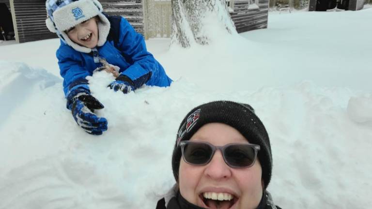 Vicki Vingoe, of Shohola, Pa., and her son Edward, 8, on the first snowday of the winter. The Vingoes moved back to the Northeast in part so Edward could experience the magic of snow.