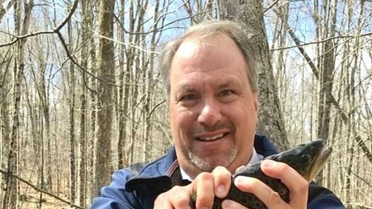 DA Hoovler helps the Orange County Federation of Sportsmen stock trout.