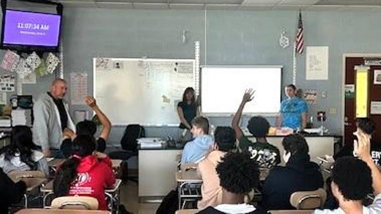 Monroe-Woodbury High School students Mia Flores and Nolnaree Chada give a presentation on the impacts of traditional gemstone mining.