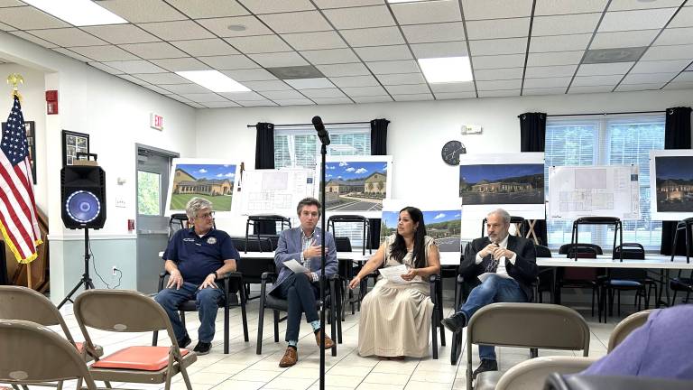 Woodbury Town Supervisor Jacqueline Hernandez (center) outlined the town’s next steps regarding transportation services at the June 29 joint Town and Village Hall meeting.