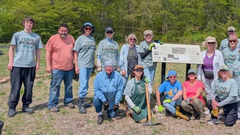 Volunteers lend a hand at the 2025 “I Love My Parks Day.” Pictured standing by the sign: Eli Hart, Jennifer Weiss, Pam Breeman, Terryanne Gmelch. Kneeling: Michele Lindsay and Susan Christensen.